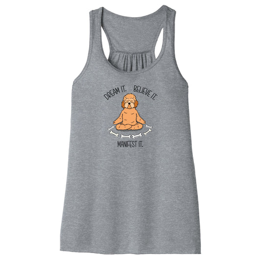 Women’s Manifest It tank top in gray 
featuring a meditating doodle dog with bones and the mantra “Dream it. Believe it. Manifest it.” in a soft, lightweight racerback style perfect for yoga and dog lovers.