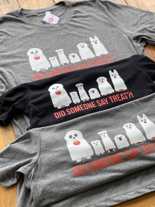 3 Halloween t-shirts with dogs in ghost costumes in flat lay.