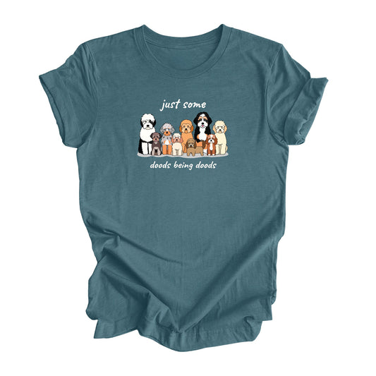 Heather teal shirt featuring a group of doodle dogs with the text 'Just some doods being doods.'