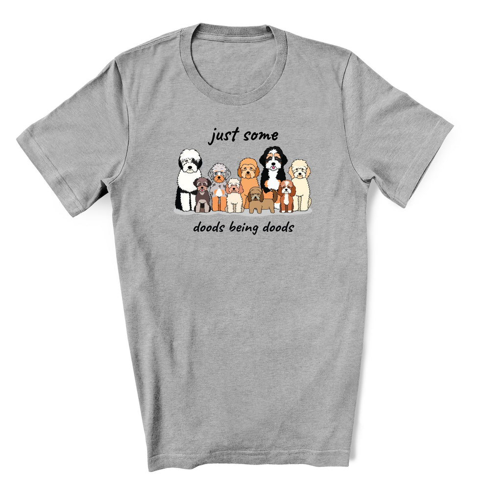 Cute gray shirt for doodle lover - it has a group of different size and types of doodle dogs with text Just some Doods being Doods