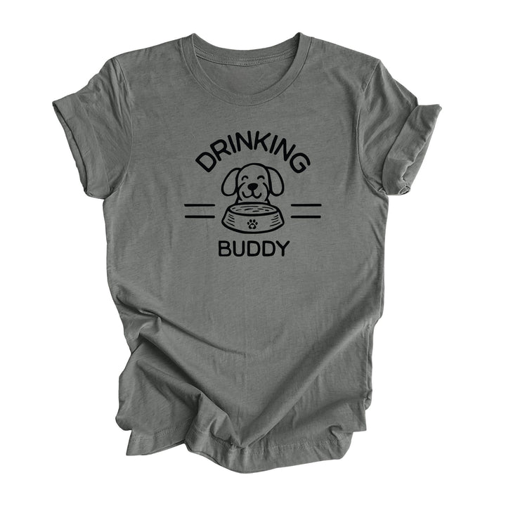 Heather gray t-shirt featuring featuring a dog and a dog bowl with the text 'Drinking Buddy.' Perfect for dog lovers who enjoy taking their furry friends to outdoor patios and breweries.