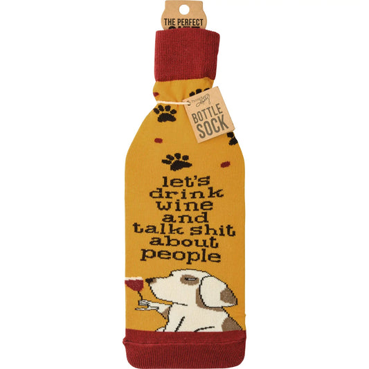 Knit bottle sock features playful paw prints and a dog sipping wine