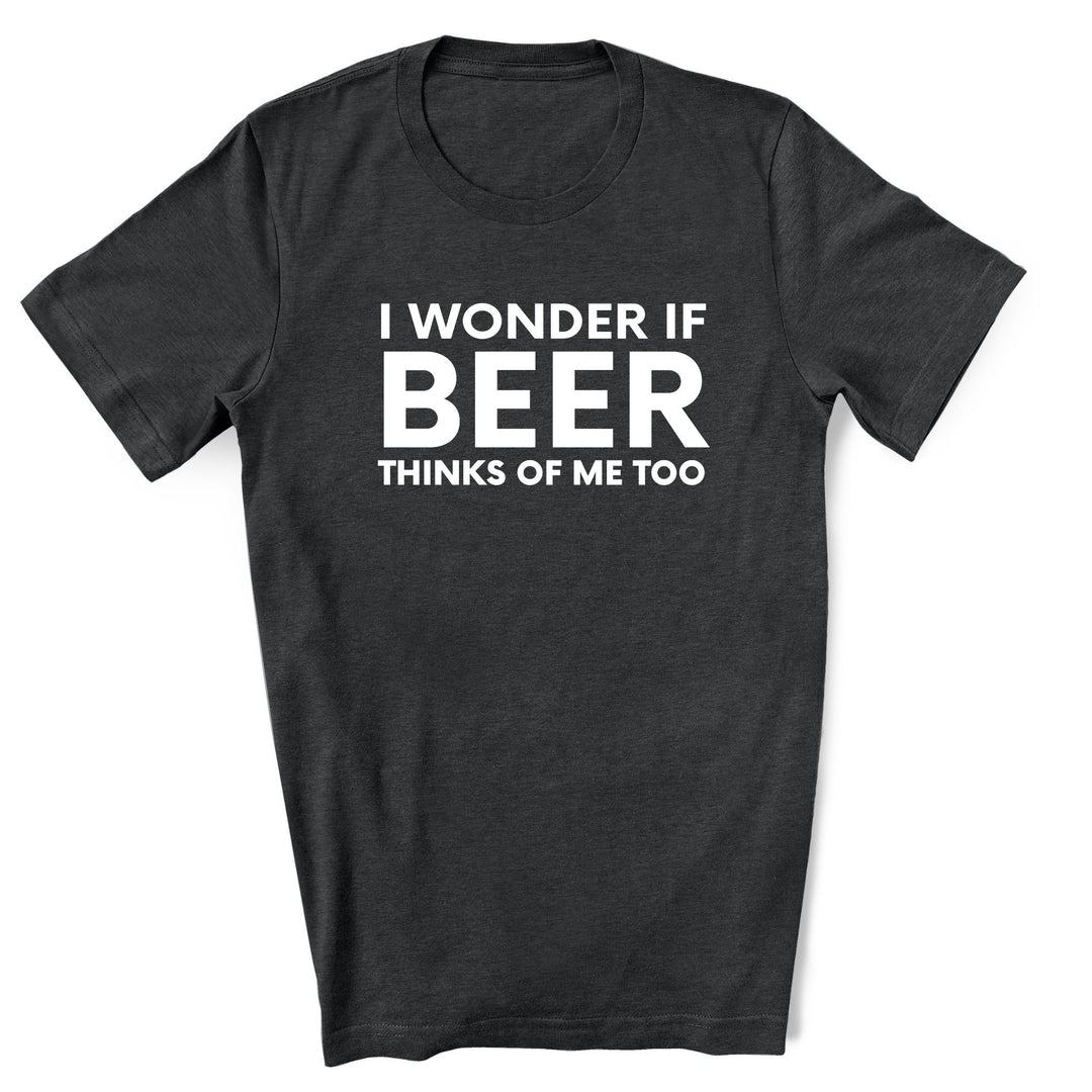 Black t-shirt with white text 'I WONDER IF BEER THINKS OF ME TOO' on a white background