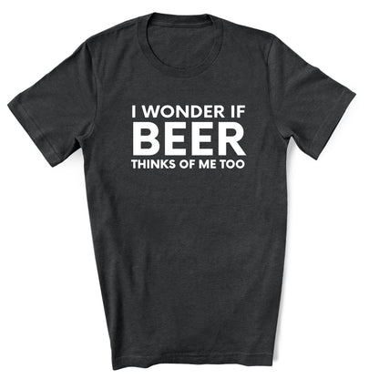 Black t-shirt with white text 'I WONDER IF BEER THINKS OF ME TOO' on a white background