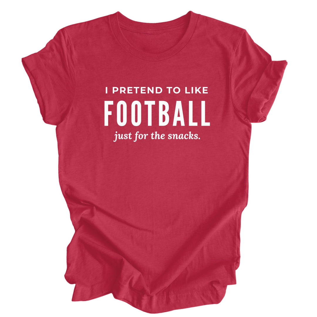 Funny football red T-shirt with white lettering that reads “I Pretend to Like Football Just for the Snacks.”