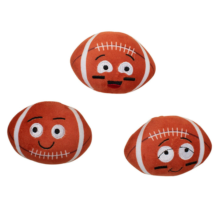 Three small plush football toys with embroidered cartoon faces, shown on a plain white background.