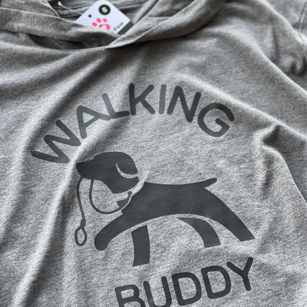 Hoodie for dog owner that says 'walking buddy' in text and in the middle a dog holding a leash in its mouth