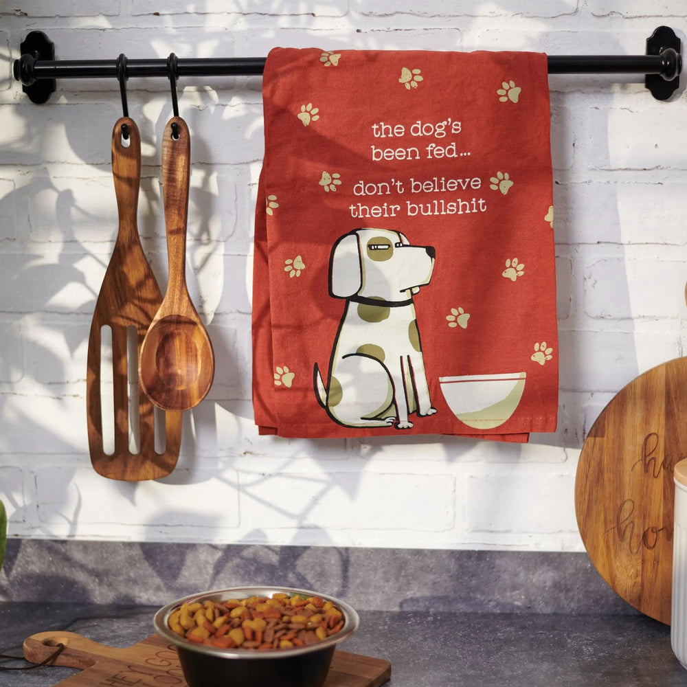 funny dog kitchen towel hanging on an oven door
