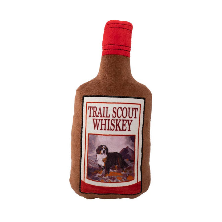 Dog toy shaped like a bottle labeled &