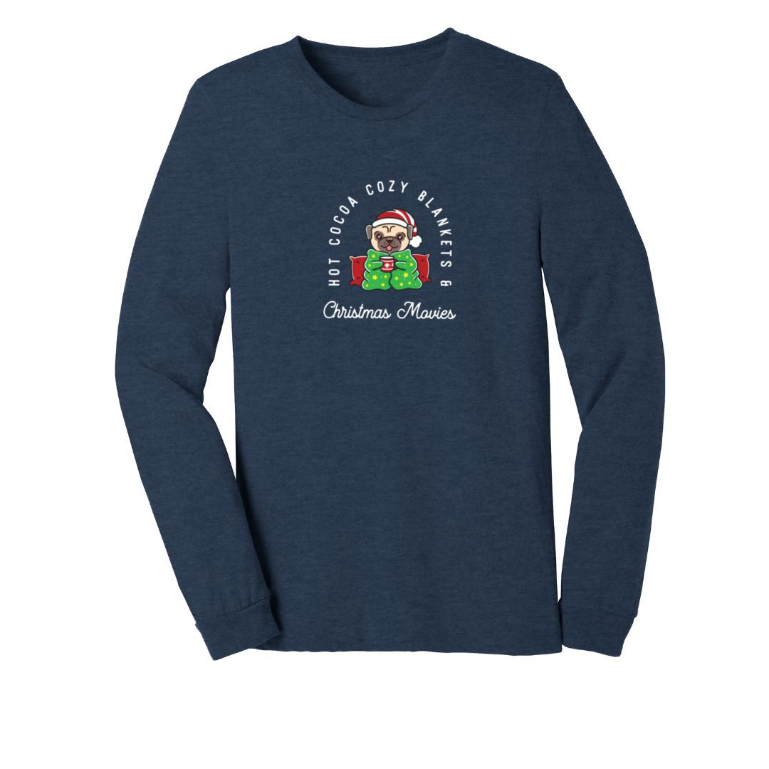 Long sleeve navy heather blue shirt with a small dog holding a coffee mug wearing a santa hat. In white text around the dog "Hot Cocoa Cozy Blankets & Christmas Movies"