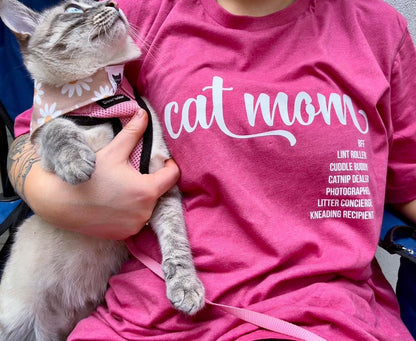 Cat Mom wearing Luv the Paw Cat Mom shirt holding her cat.