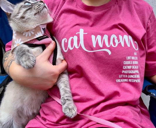 Cat Mom wearing Luv the Paw Cat Mom shirt holding her cat.